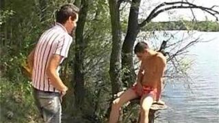 Cute boy getting plowed by two gay mates outdoors - porn video